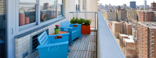Balcony with blue chairs